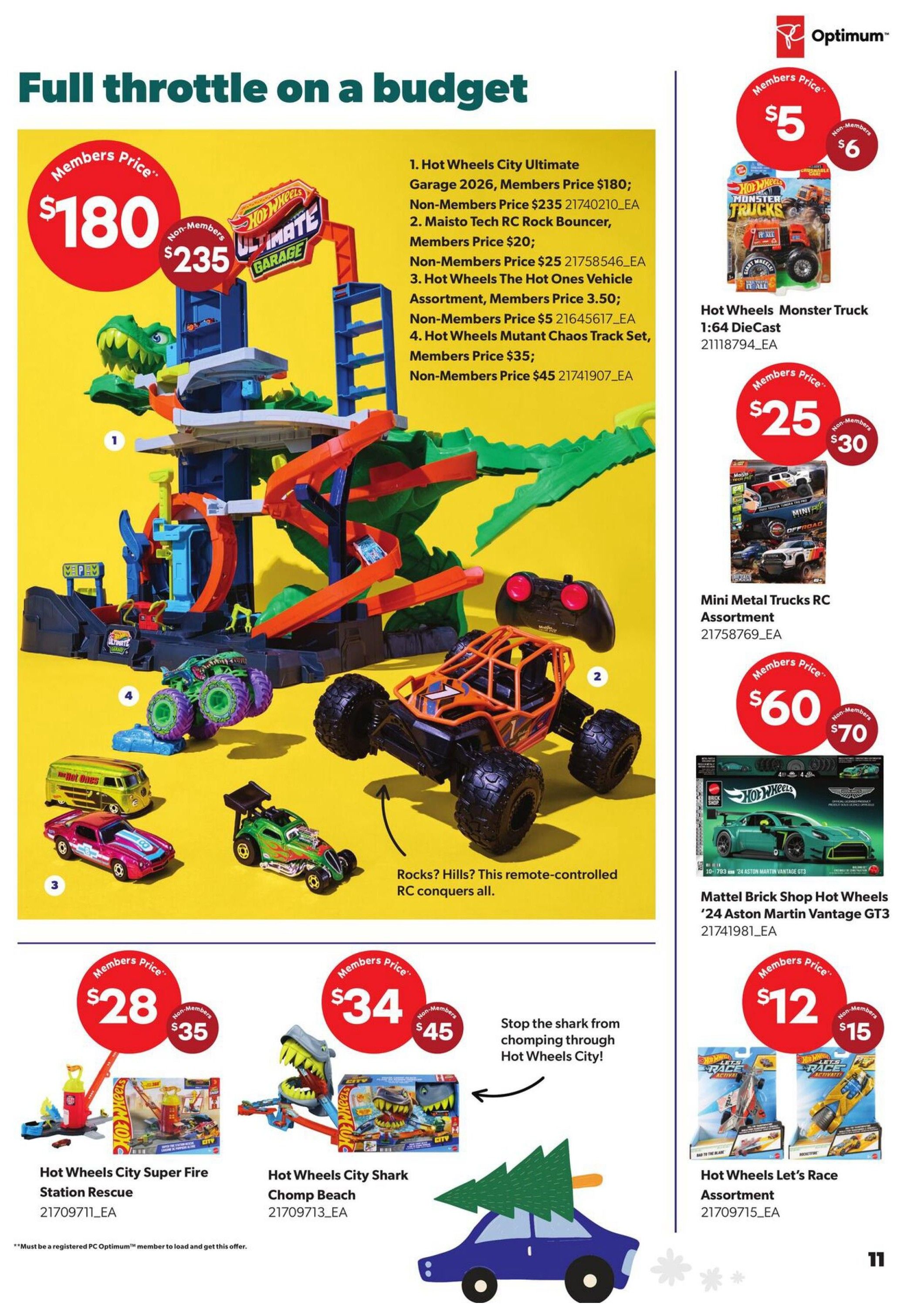 Real Canadian Superstore Toy Book flyer, page 11. Featured are various Hot Wheels toys. The main image showcases the Hot Wheels City Ultimate Garage 2026 for a Members Price of $180, Non-Members Price $235. Also available are Maisto Tech RC Rock Bouncer for Members Price $20, Non-Members Price $25; Hot Wheels The Hot Ones Vehicle Assortment for Members Price $3.50, Non-Members Price $5; and Hot Wheels Mutant Chaos Track Set for Members Price $35, Non-Members Price $45. On the right side, Hot Wheels Monster Truck 1:64 Die Cast is $5 for Members and $6 for Non-Members. Mini Metal Trucks RC Assortment is $25 for Members and $30 for Non-Members. Mattel Brick Shop Hot Wheels '24 Aston Martin Vantage GT3 is $60 for Members and $70 for Non-Members. Hot Wheels City Super Fire Station Rescue is $28 for Members and $35 for Non-Members. Hot Wheels City Shark Chomp Beach is $34 for Members and $45 for Non-Members. Hot Wheels Let's Race Assortment is $12 for Members and $15 for Non-Members. A blue car with a Christmas tree on top is also pictured.