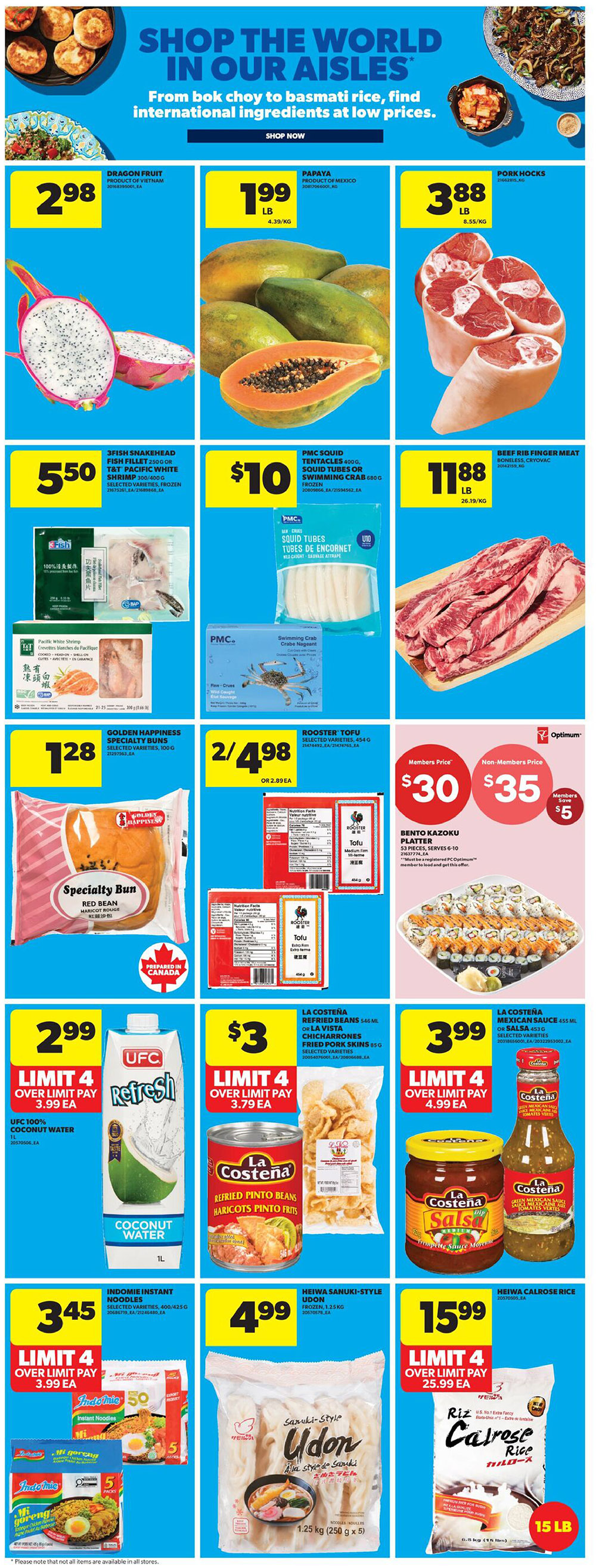 Real Canadian Superstore weekly flyer specials page 19 features a 'Shop the World in Our Aisles' theme. Featured items include Dragon Fruit for $2.98, Papaya for $1.99 per lb, and Pork Hocks for $3.88 per lb. Also available are 3Fish Snakehead Fish Fillet or T&T Pacific White Shrimp for $5.50, PMC Squid Tentacles or Swimming Crab for $10, and Beef Rib Finger Meat for $11.88 per lb. Golden Happiness Specialty Buns are $1.28. Rooster Tofu is 2 for $4.98 or $2.89 each. A Bento Kazoku Platter is $30 for members, $35 for non-members, with a $5 member saving. UFC 100% Coconut Water is $2.99 with a limit of 4. La Costena Refried Pinto Beans or Fried Pork Skins are $3 with a limit of 4. La Costena Mexican Sauce is $3.99 with a limit of 4. Indomie Instant Noodles are $3.45 with a limit of 4. Heiwa Sanuki-Style Udon is $4.99. Heiwa Calrose Rice (15 lb bag) is $15.99 with a limit of 4.
