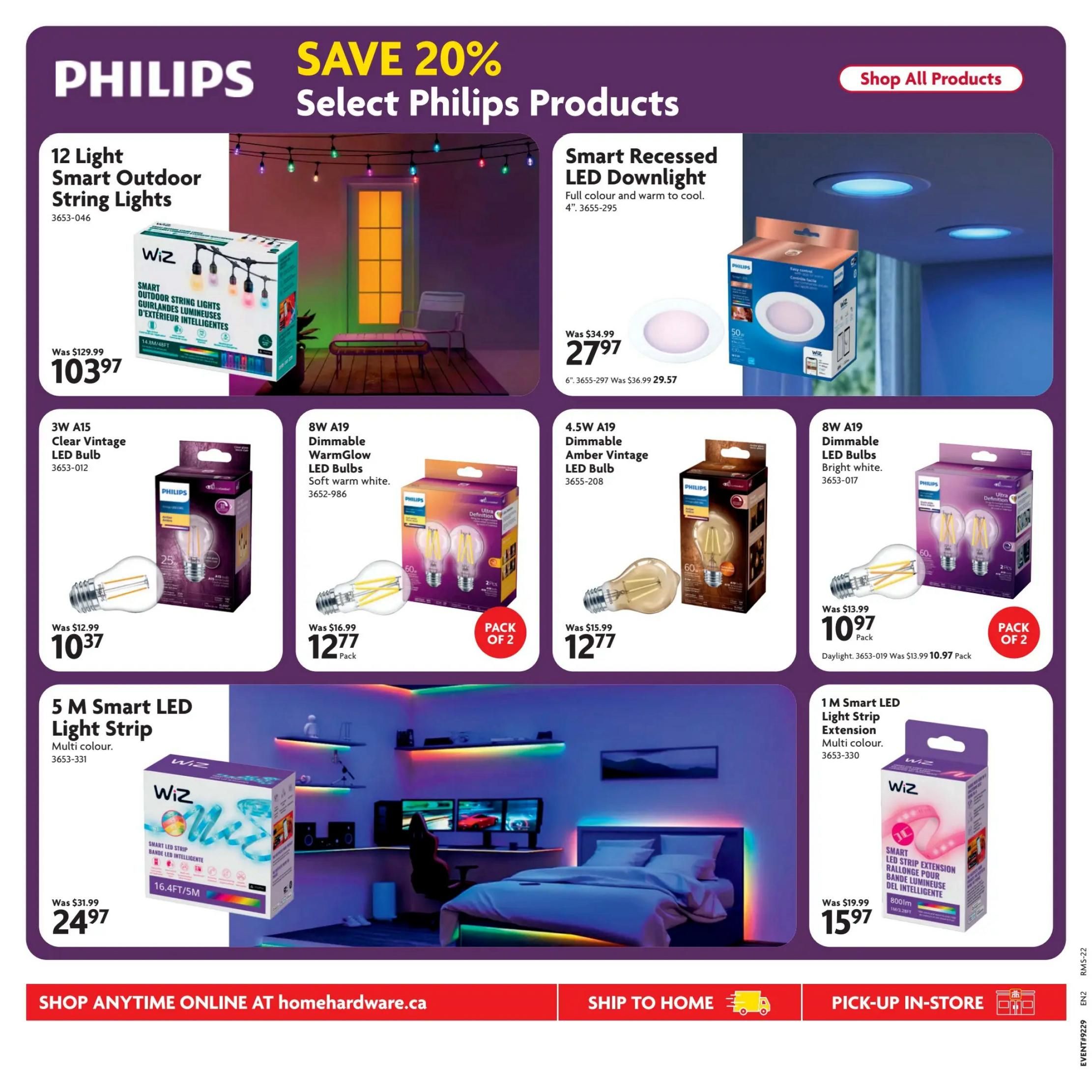 Home Hardware Atlantic flyer specials page 24 features Philips products with savings up to 20%. Highlighted items include 12 Light Smart Outdoor String Lights for $103.97 (was $129.99), Smart Recessed LED Downlight for $27.97 (was $34.99), 3W A15 Clear Vintage LED Bulb for $10.37, 8W A19 Dimmable WarmGlow LED Bulbs (Pack of 2) for $12.77 (was $16.99), 4.5W A19 Dimmable Amber Vintage LED Bulb for $12.77 (was $15.99), 8W A19 Dimmable LED Bulbs Bright White (Pack of 2) for $10.97 (was $13.99), 5M Smart LED Light Strip Multi-colour for $24.97 (was $31.99), and 1M Smart LED Light Strip Extension Multi-colour for $15.97 (was $19.99). The page also shows a lifestyle image of a bedroom with smart LED lighting. Options to shop anytime online at homehardware.ca, ship to home, or pick-up in-store are available.