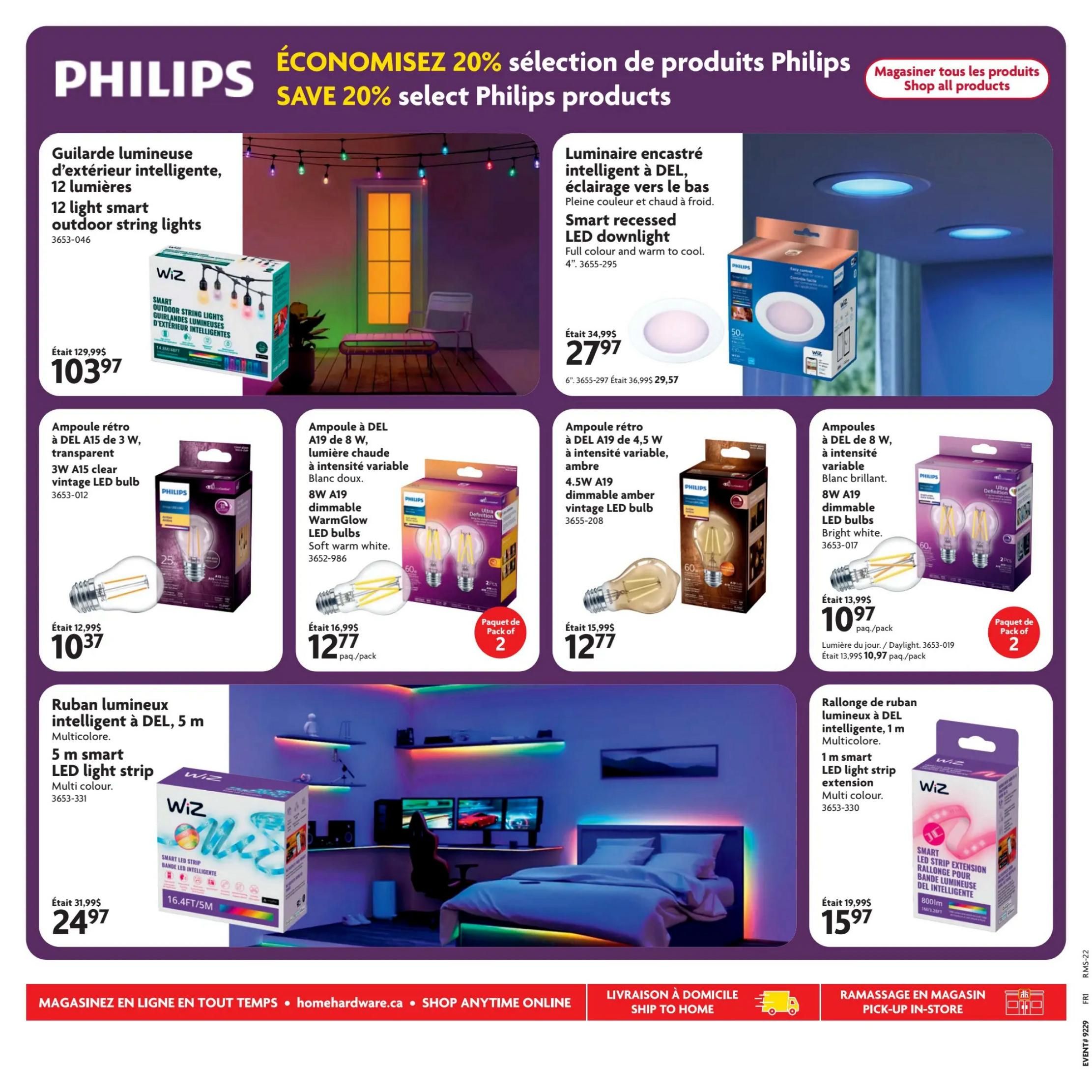 Home Hardware flyer page 24 featuring Philips lighting products with savings of 20%. Products include a 12-light smart outdoor string light kit, originally $129.99, now $103.97. A smart recessed LED downlight is on sale for $27.97, down from $34.99. Also available are various LED bulbs: a 3W A15 clear vintage LED bulb for $10.37 (was $12.99), an 8W dimmable WarmGlow LED bulb pack for $12.77 (was $16.99), and another 8W A19 dimmable LED bulb pack in bright white for $10.97 (was $13.99). A 5m multicolour smart LED light strip is priced at $24.97 (was $31.99), and a 1m multicolour smart LED light strip extension is $15.97 (was $19.99). The page also shows a bedroom scene with LED strip lighting.