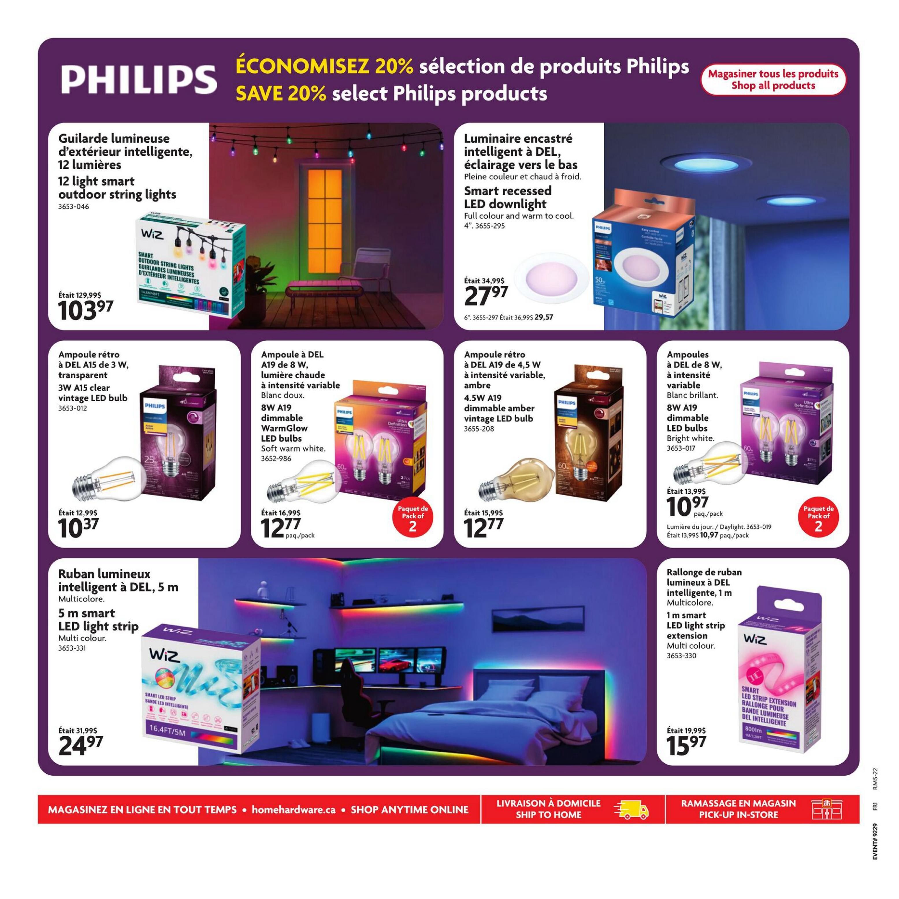 Home Hardware flyer page 29 features a 20% savings on select Philips products. Highlighted items include a 12-light smart outdoor string lights for $103.97 (originally $129.99), and a 4' smart recessed LED downlight in full colour and warm to cool for $27.97 (originally $34.99). Also available are Philips LED bulbs: 3W A15 clear vintage LED bulbs for $10.37 (originally $12.99), 8W A19 dimmable WarmGlow LED bulbs in soft warm white for $12.77 per pack (originally $16.99), and 4.5W A19 dimmable amber vintage LED bulbs for $12.77. Additionally, find a 5m smart LED light strip in multicolour for $24.97 (originally $31.99) and a 1m smart LED light strip extension in multicolour for $15.97 (originally $19.99). The page also shows Philips branding and a 'Shop all products' call to action.