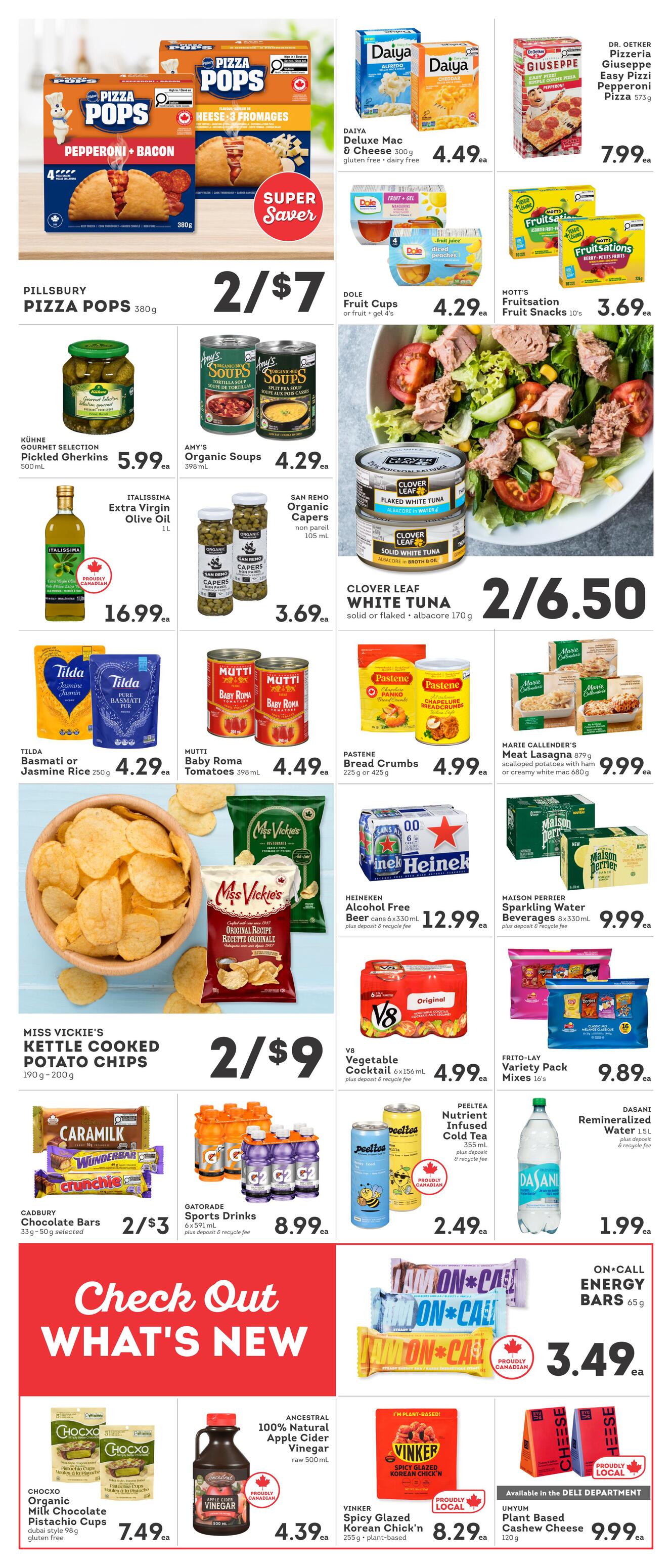 IGA British Columbia weekly flyer specials, Page 4. Featured items include Pillsbury Pizza Pops for 2 for $7, Daiya Deluxe Mac & Cheese for $4.49 each, Dr. Oetker Giuseppe Easy Pizza Pepperoni for $7.99 each, Dole Fruit Cups for $4.29 each, and Mott's Fruitations Fruit Snacks for $3.69 each. Also available are Kühne Pickled Gherkins for $5.99 each, Amy's Organic Soups for $4.29 each, Clover Leaf White Tuna for 2 for $6.50, and San Remo Organic Capers for $3.69 each. Italisima Extra Virgin Olive Oil is $16.99. Tilda Basmati or Jasmine Rice is $4.29 each, Mutti Baby Roma Tomatoes are $4.49 each, and Pastene Bread Crumbs are $4.99 each. Miss Vickie's Kettle Cooked Potato Chips are 2 for $9. Marie Callender's Meat Lasagna is $9.99. Heinken Alcohol Free Beer 6-pack is $12.99 plus deposit and recycle fee. Maison Perrier Sparkling Water 8-pack is $9.99 plus deposit and recycle fee. V8 Vegetable Cocktail 6-pack is $4.99 plus deposit and recycle fee. Frito-Lay Variety Pack Mixes 16's are $9.89. Cadbury Chocolate Bars are 2 for $3. Gatorade Sports Drinks 6-pack is $8.99 plus deposit and recycle fee. Peeltea Nutrient Infused Cold Tea is $2.49 each. Dasani Remineralized Water is $1.99. On-Call Energy Bars are $3.49. Chocxo Organic Milk Chocolate Pistachio Cups are $7.49 each. Ancestral 100% Natural Apple Cider Vinegar is $4.39 each. Vinker Spicy Glazed Korean Chick'n is $8.29 each. Umyum Plant Based Cashew Cheese is $9.99. The page also features a 'Check Out What's New' section.